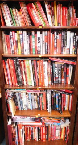 Manchester United. Books to include records, biographies and autobiographies, history of the club, and official reviews, hard and soft back. (5 shelves)