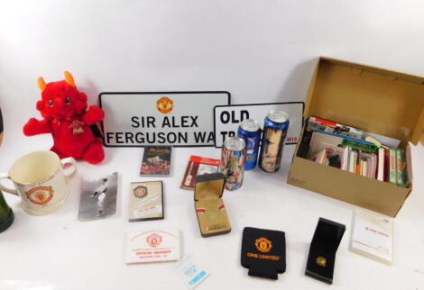 Manchester United. Members Season voucher books, tapes, commemorative coins, Eric Cantona Lager, Wade Manchester United European Cup Winners Cup 1991, signs and a Russ MU FC Devil. (a quantity)