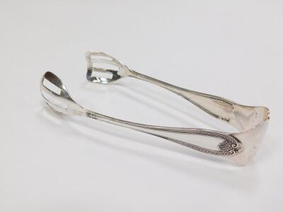 A pair of Continental cake serving tongs, white metal, with embossed shell and scroll moulding, stamped 800, 2.15oz - 2