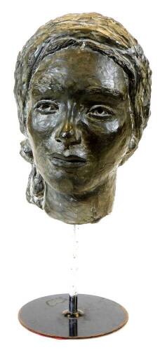 A 20thC spelter head sculpture formed as a lady, facing front on a plain stem and circular foot, 45cm high.