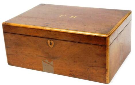 A 19thC mahogany vanity box, of rectangular form the lid with a cross banding initialled FH, blind fret section and a further lift out section, 19cm high, 46cm wide, 31cm deep.