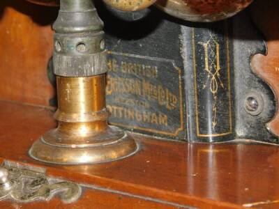 A British LM Ericsson vintage wall hanging telephone, in shaped case with domed top, chrome plated metal bells and shaped receiver attached by a green cord, 68cm high. - 2