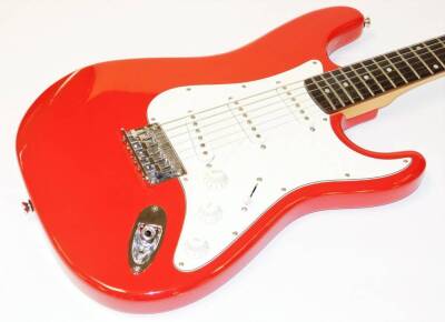 A Squier Fender Bullet six string electric guitar, in red and white colourway, 101cm wide, in associated canvas case. - 2