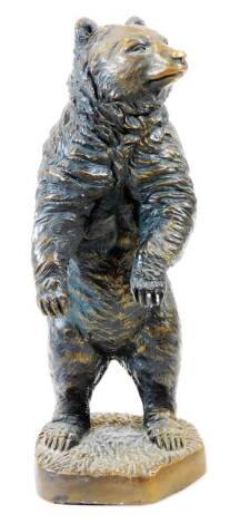 A Black Forest style figure of a standing bear, with textured coat, on shaped base, unsigned, 36cm high.