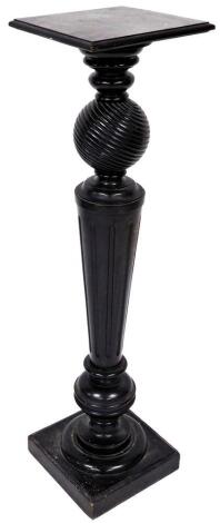 An early 20thC ebonised plant stand, with square top on an orb and tapering reeded stem, with compressed orb beneath on a square base, 110cm high, the top 28cm x 28cm.