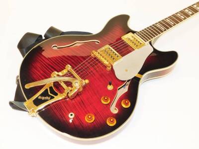 A Bigsby Shine electric guitar, with mother of pearl style inlay, shaped body, with various knops, brass finish mounts, with Ritter canvas case, 108cm wide. - 3