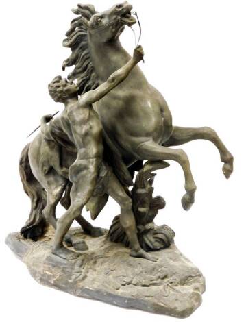 A late 19thC spelter classical Marley horse figure group, of rearing horse and classical semi clad figure on shaped base, 60cm high.