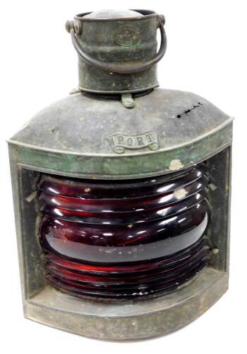 An early 20thC S Fay and Sons corner port light, with red glass centre and shaped case with cylindrical top and swing handle, named and labelled to the front, 48cm high. (AF)