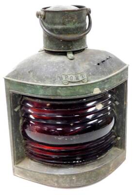 An early 20thC S Fay and Sons corner port light, with red glass centre and shaped case with cylindrical top and swing handle, named and labelled to the front, 48cm high. (AF)