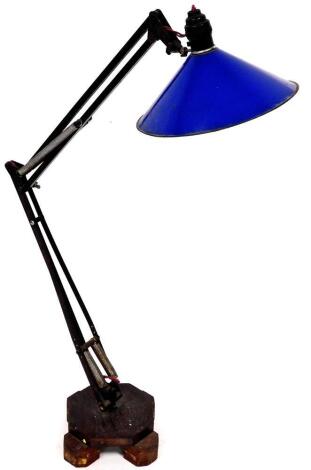 A 20thC anglepoise lamp, with wide blue shade and metal stem on a shaped foot, 105cm high.