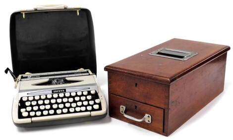 An early 20thC vintage shop till, of rectangular form with chrome opening and front drawer, 46cm deep, and a Zephyr Corona typewriter. (2)