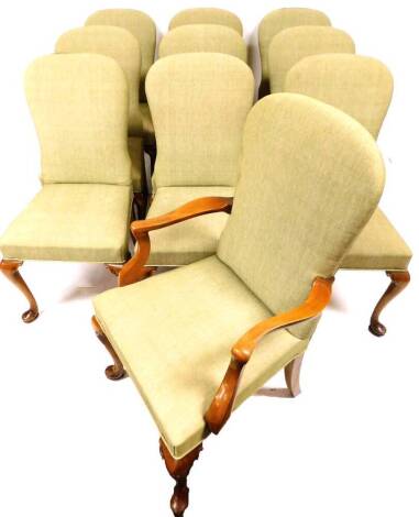 A set of nine (8+1) Beresford & Hicks walnut framed dining chairs, each with elongated spoon backs and plain seats, overstuffed in a later green material, on cabriole front pad legs carved to each knee, labelled beneath, 95cm high.