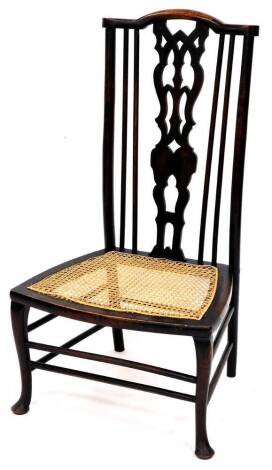 An early 20thC stained beech chair, with pierced back splat, bergere seat and cabriole front legs, with a double cylindrical stretcher, 86cm high.