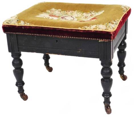 A late 19thC ebonised walnut piano stool, with rectangular overstuffed petit point top, on turned legs terminating in castors, 45cm high, 58cm wide, 50cm deep.