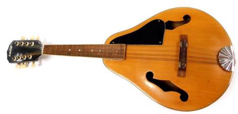 A 20thC E Ross mandolin, with tuning knops, shaped body and eight strings, 66cm wide.