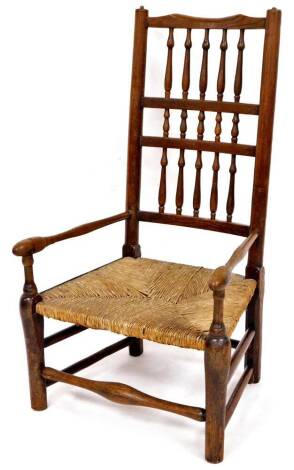 A late 19thC Lancashire style low chair, with triple bobbin turned back splat, turned arms and rush seat, on turned cylindrical legs, joined by a horizontal stretcher, 95cm high.