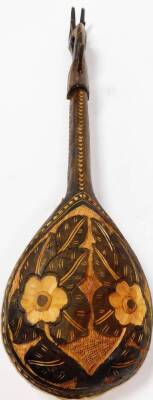 A 20thC African tribal musical instrument, with single string and springbok style head, with plain tear shaped body, 84cm high. - 2
