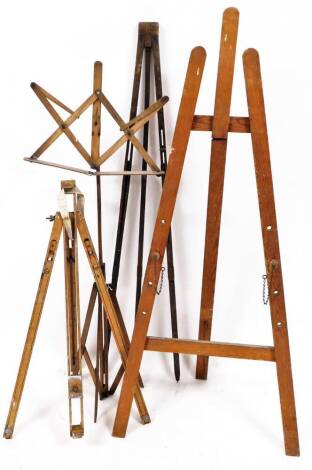 A pine stained folding artist's easel, with plain back, another by Reeves and Son, of shaped articulated form, 127cm high, and various other artists easels. (a quantity)