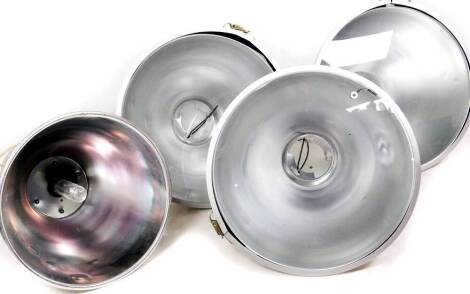 Three large chrome cased foot lights, of domed form with circular glass fronts, 50cm diameter.