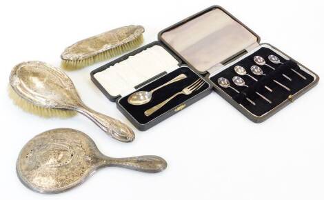 A George V matched silver three piece dressing table set, comprising clothes brush, Birmingham 1917, 18cm high, hand mirror, etc., a set of six bean spoons and cased fork and spoon set.