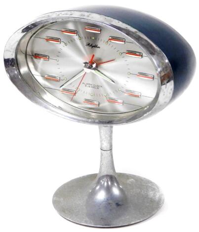 A retro Japanese Rhythm mantel clock, in oval case on an inverted stem and circular foot, with horizontal numerals, 20cm high.