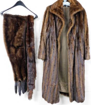 A 20thC ladies fur coat, three quarter length, and two various stoles, size unknown.