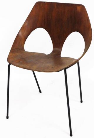 A 1960's Kandya plywood chair, on black metal legs, with pierced shaped back, labelled to the underside, 70cm high.