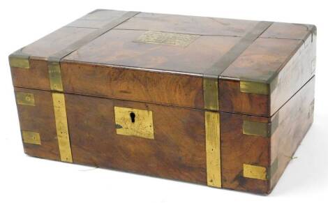 A 19thC walnut box, with metal banding and central cartouche dated October 2nd 1889, 15cm high, 35cm wide, 24cm deep.