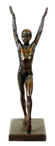 After Hromych. A bronzed Art Deco figure of a lady or ballerina, with arms raised, on a plain rectangular base, signed, 42cm high.