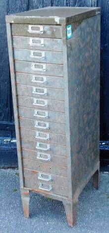 A Constructors Electriques metal 15 drawer narrow filing cabinet, on tapering legs, in green, 102cm high, 28cm wide, 41cm deep.