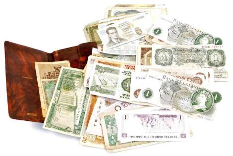 Various bank notes, to include one pound, Page X2OB, ten shilling, Fforde 97Y332238, various others, Peppiatt one pound, G06B127071, various other bank notes, world bank notes, etc., contained in a leather finish wallet. (a quantity)