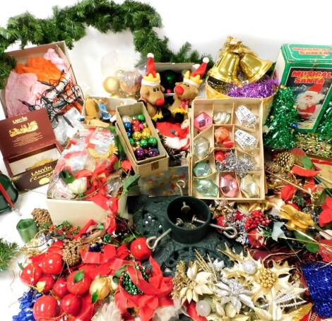 A large quantity of various Christmas decorations, early 20thC and later, Christmas tree stand, various baubles, tinsel and effects. (a quantity)