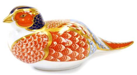 A Royal Crown Derby bird paperweight ornament, Imari pattern with gold stopper, 7cm high.