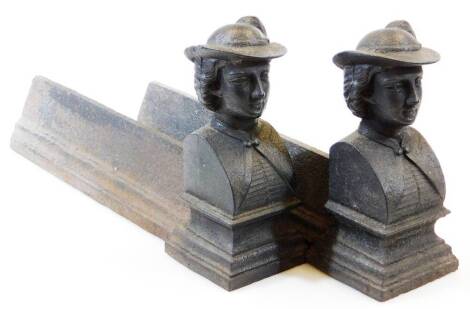 A pair of early 20thC cast iron andirons, formed as figures of ladies, quarter profile wearing hats, on square stepped bases, 25cm high, 11cm wide, 41cm deep.