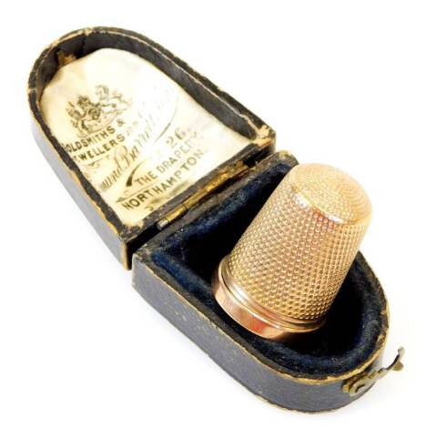 A 9ct gold thimble, of typical form, 2cm high, 3.5g. (in fitted case)