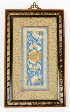 An early 20thC Chinese silk work, of rectangular form set with various flowers and insects, with a floral border, glazed and framed, 35cm x 20cm.