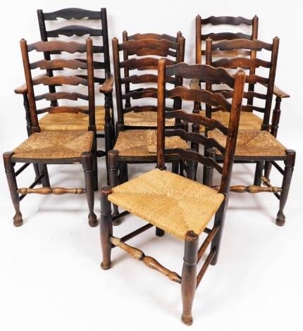 A set of seven (6+1) oak ladder back dining chairs, with rush seats, on turned legs joined by turned stretchers, 114cm high, etc. (7)