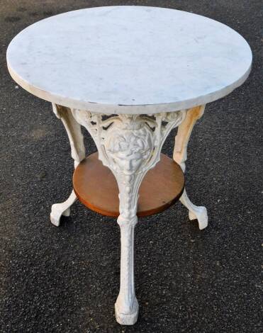 A pub table, with circular marble finish top, on classical mask legs, terminating in paw feet, joined by an oak under tier, 70cm high, 61cm diameter.