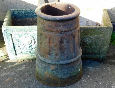 Various garden statuary, a matched pair of square tapering concrete planters, one decorated in green, 30cm high, 36cm wide, 40cm deep, and a cylindrical shaped chimney pot.