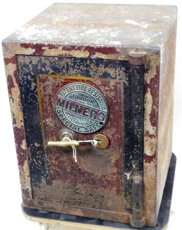 An early 20thC Milner fire resistant special cast iron safe, circa 1912, of rectangular form, with key and front shaped handled, raised with circular plaque, 63cm high, 46cm wide, 49cm deep. This brand of safe was used on The Titanic.