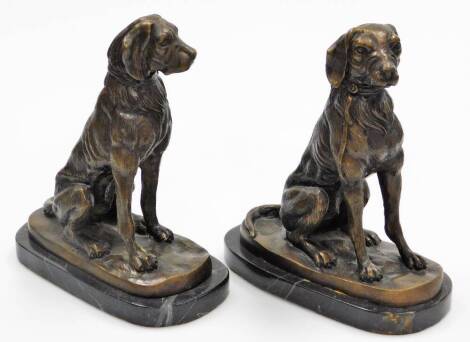 A pair of bronze finish spelter figures, of standing dogs on oval marble finish bases, unsigned, 24cm high.