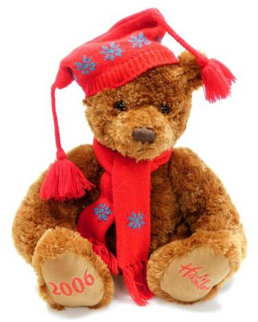 A Hamleys plush jointed 2006 teddy bear, in brown, 34cm high.