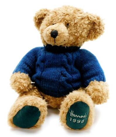 A Harrods plush jointed 1998 teddy bear, wearing turquise jumper, 36cm high.