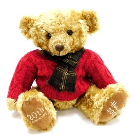 A Harrods plush jointed 2005 20th anniversary teddy bear, in brown, wearing red jumper and Burberry tartan style scarf, 44cm high.