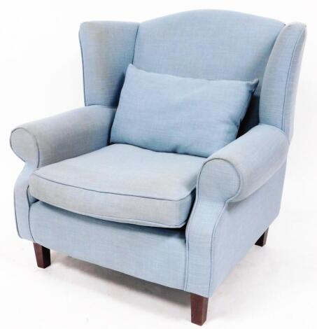 A late 19thC mahogany framed wing chair, with high back and deep seat, on tapering square front legs, in later turquoise colour material, with cushions, 90cm high.