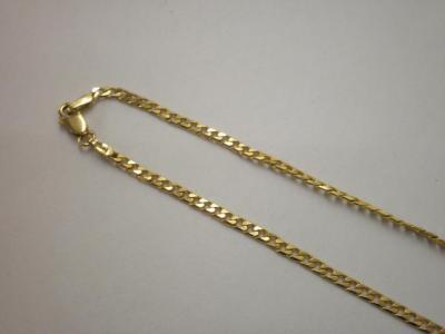 A flat curb link chain marked for 9ct