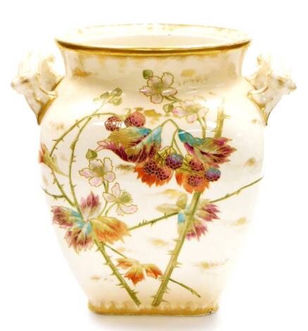 An early 20thC Royal Bonn German jardiniere, of shaped form raised with brambles and decorated predominantly in purple, green and turquoise, with gilt highlights, printed marks beneath, 32cm high.