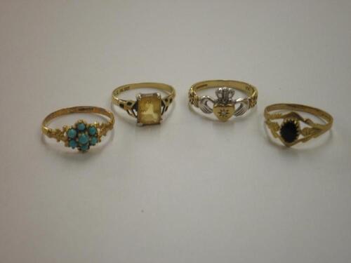 Four 9ct gold stone set rings