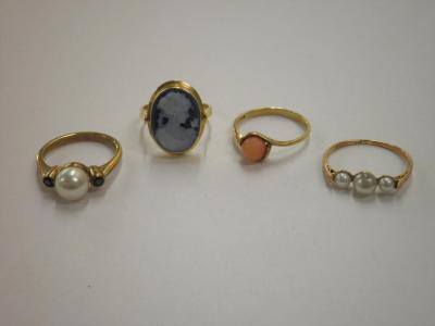 Four 9ct gold stone set rings