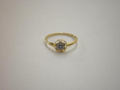 A 1920's style ring set with a floral plaque to 9ct gold shank<br